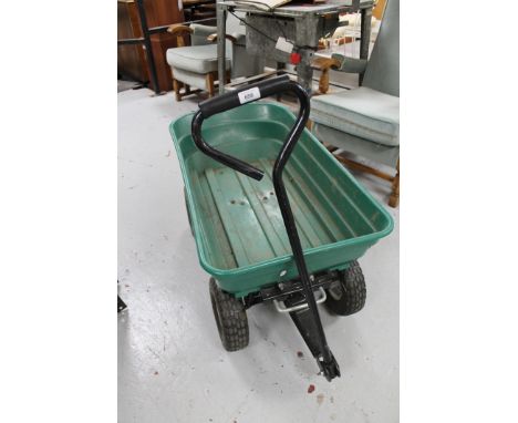 Two plastic garden trolleys together with a hose pipe on reel