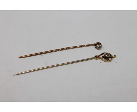 Two antique gold diamond set stick pins, about 0.3ct total 