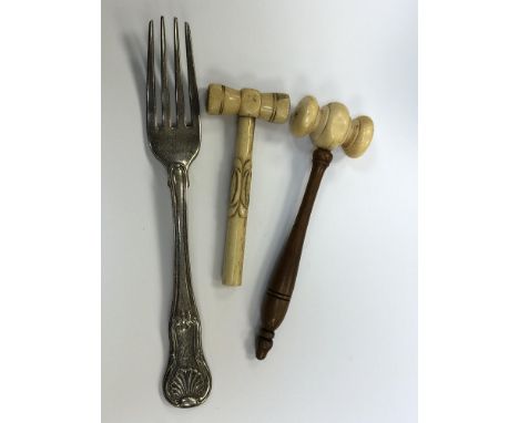 A Georgian silver table fork and a 19th century ivory tipped gavel and a bone gavel. (3) CONDITION REPORT: Fork 64.3g. 