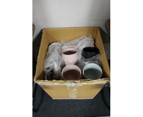 A box of ceramic vases 
