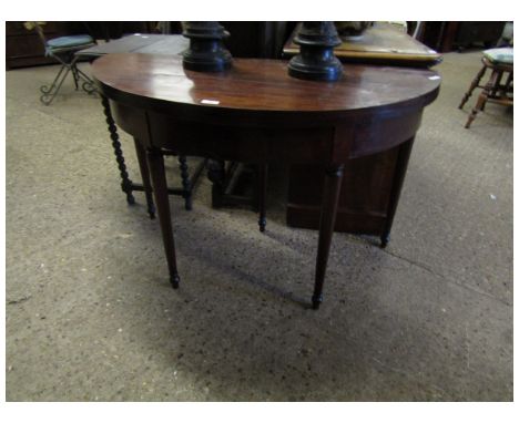 19TH CENTURY MAHOGANY DEMI-LUNE FOLD OVER CARD TABLE ON FOUR TURNED LEGS (A/F)   