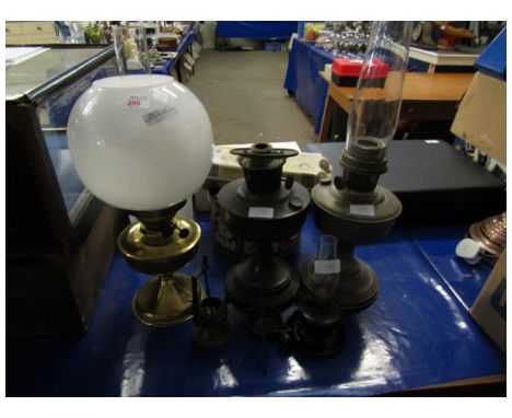 THREE VICTORIAN BRASS OIL LAMPS TOGETHER WITH A METAL PEG LAMP AND FURTHER LAMP (5)   
