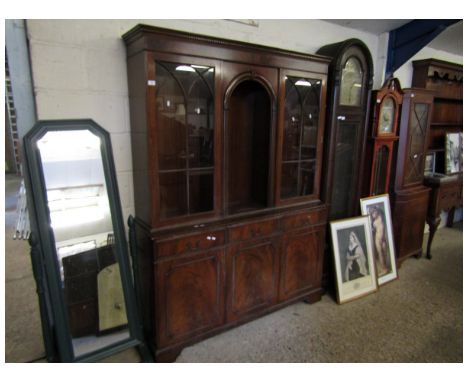 REPRODUCTION MAHOGANY LIVING ROOM CABINET WITH CENTRAL ARCHED OPEN SHELF FLANKED EITHER SIDE BY GLAZED DOORS, THE BASE WITH T