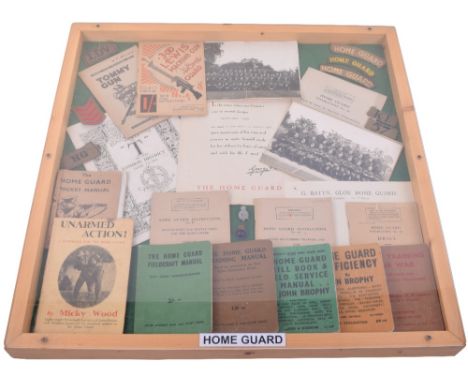 Display of WW2 Home Guard Cloth Insignia and Ephemera, including variations of cloth HOME GUARD shoulder titles, black on kha