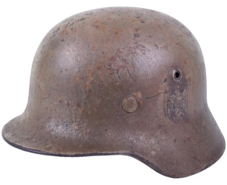 WW2 German Army Normandy Camouflaged Steel Combat Helmet, Model 1940 steel helmet with remains of the original German army de