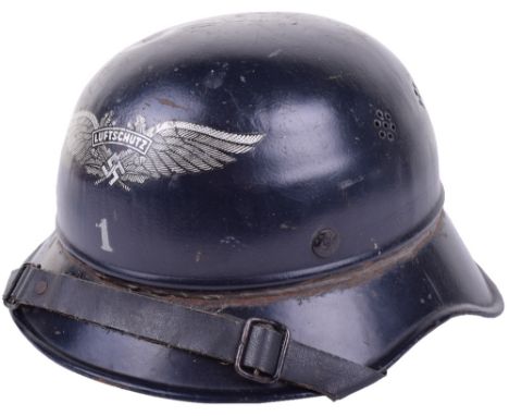 WW2 German Luftschutz Gladiator Pattern Steel Helmet, dark navy blue painted shell with Luftschutz winged decal to the front 