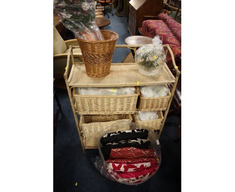 A VINTAGE DISPLAY STAND WITH SHELVES AND BASKETS, TWO FAUX FLOWERS, SELECTION OF CUSHIONS ETC