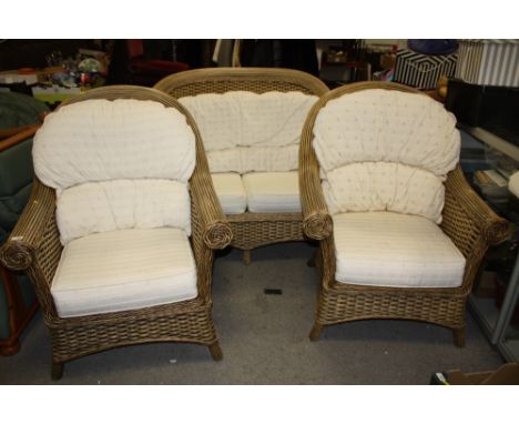 A MODERN THREE PIECE WICKER CONSERVATORY SUITE COMPRISING TWO SEATER SOFA AND TWO CHAIRS