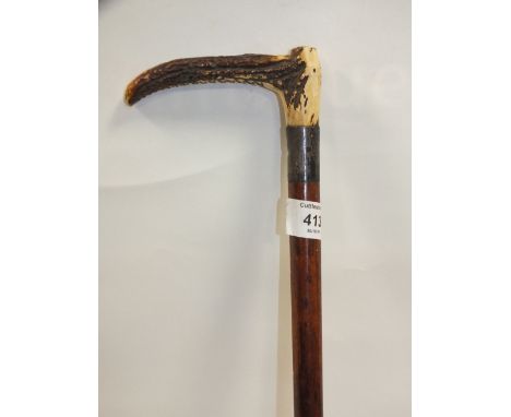 A VINTAGE HALLMARKED SILVER HORN HANDLED RIDING CROP