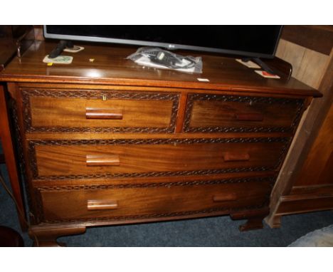 A VINTAGE MAHOGANY TWO OVER TWO CHEST OF DRAWERS WITH CARVED DETAIL - W 114 cm