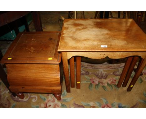 AN ANTIQUE MAHOGANY COMMODE TOGETHER WITH A NEST OF TABLES