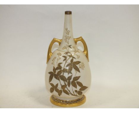 A ROYAL WORCESTER GILT TWIN HANDLED SPECIMEN VASE