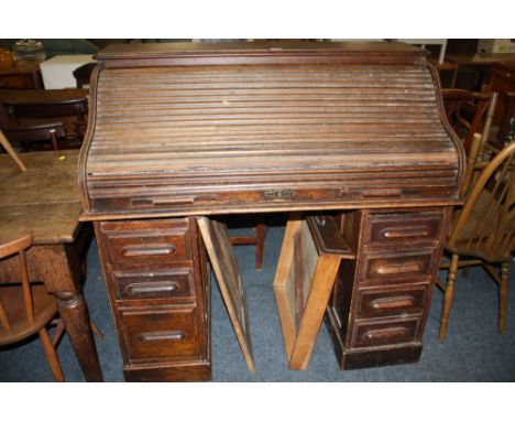 A VINTAGE OAK TAMBOUR ROLL TOP DESK WITH MULTI DRAWERS W - 120CM