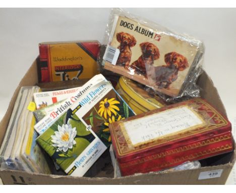 A LARGE QUANTITY OF CIGARETTE CARDS, VINTAGE TINS ETC