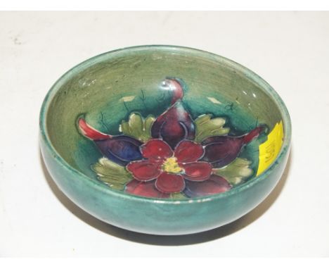 A SMALL VINTAGE FLORAL MOORCROFT BOWL 