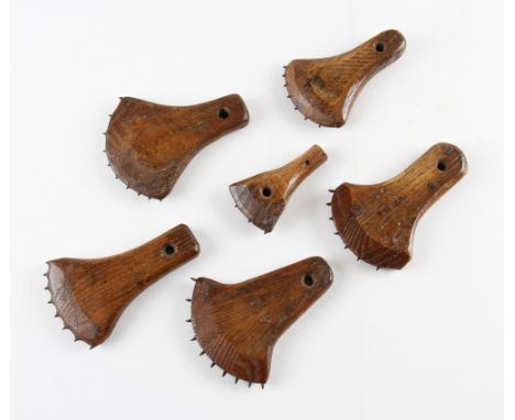 Tennis Racket Fabrication Tools - Marking Out Tools - a selection of wooden axe shaped tools with sharp teeth used to positio