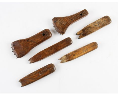 Tennis Racket Fabrication Tools - Marking Out Tools - a selection of elongated wooden shaped tools with sharp teeth used to p