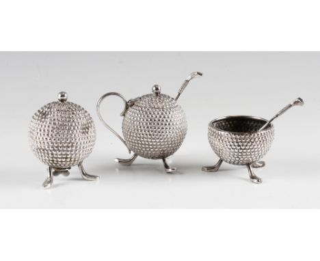 Early silver plated golf ball cruet set - 3x bramble golf ball pattern condiments each mounted on 3x longnose feet, together 