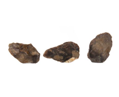 THREE POLISHED STONE AGE AXE HEADS,possibly of Scandinavian origin, the largest 10.5cm long (3)
