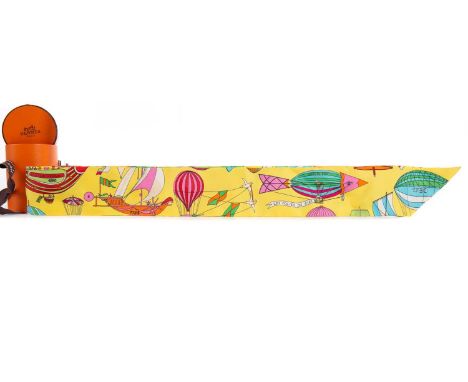 HERMES TWILLY LADY'S SCARF,made in France, 100% silk, decorated with balloons and airships on a yellow ground, 85cm long, box