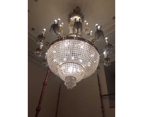 LARGE AND IMPRESSIVE BRASS TWO TIER WATERFALL CHANDELIER,the ceiling fixture surrounded by cast fronds to chromed column, the