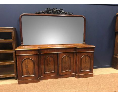 VICTORIAN MAHOGANY MIRROR-BACK INVERTED BREAKFRONT SIDEBOARD,with carved surmount on plinth base, 231cm wide