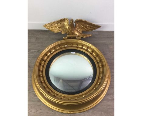 REGENCY STYLE GILT GESSO CONVEX WALL MIRROR,with eagle surmount and beading, 84cm high, 61cm diameter