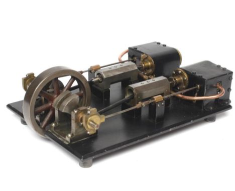 A twin cylinder non-reversing mill type engine mounted on metal base, 13" x 9", F (Est. plus 21% premium inc. VAT)