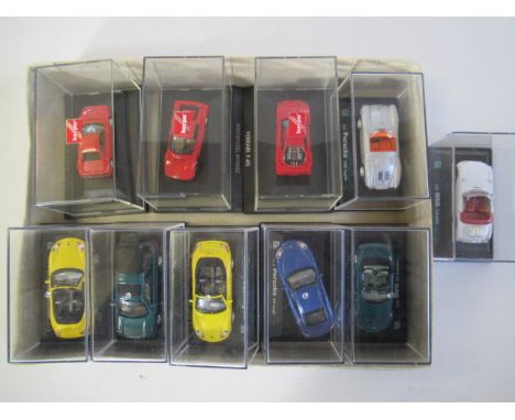 Ten 1:74 scale car including Ferrari, Porsche and MG, boxed (Est. plus 21% premium inc. VAT)