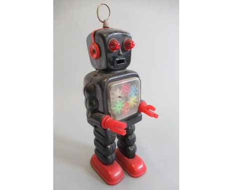 Clockwork walking robot by Ko Yoshiya, Japan, walking action with transparent gears on chest, some ageing to paintwork, motor