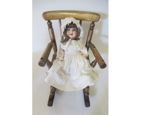 An Armand Marseille bisque socket head character doll, with blue glass sleeping eyes, open mouth, teeth, trembling tongue, br