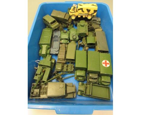Twenty six army vehicles by Dinky and others including trucks, field guns and armoured cars, some items over painted, F (Est.