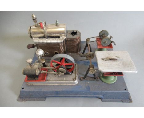 Wilesco stationary steam engine, spirit fired, single cylinder driving two power tools, some minor damage to plate work, chim