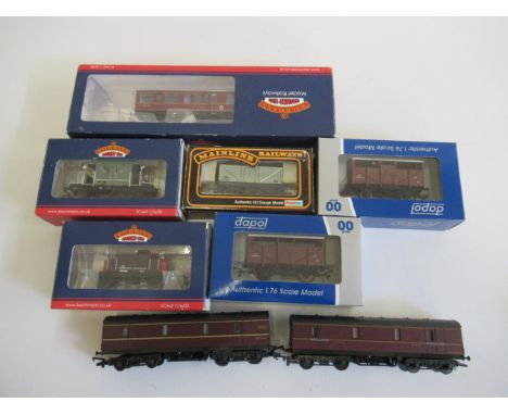 Rolling stock by Dapol and Bachmann including two brake vans, two cattle wagons, two L.M.S. parcel vans and an L.M.S. Inspect