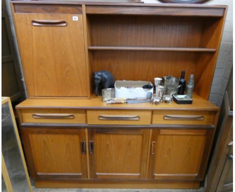 A 1970's GPlan teak high sideboard with shelf and cocktail cabinet back, 56" wide 