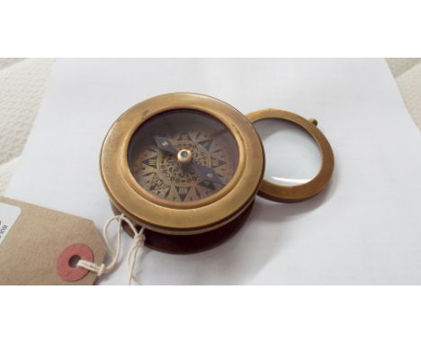 Brass compass with magnifying glass