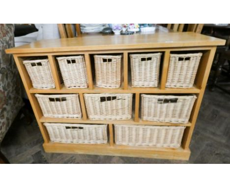 A light oak chest fitted ten wicker drawers 