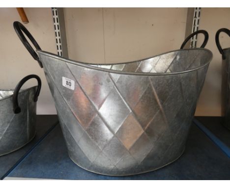 A large oval planter 53 x 43 x 28 cms deep