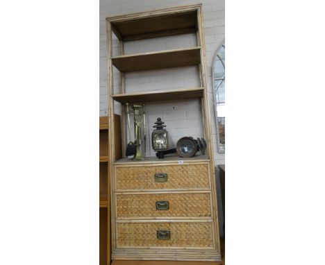 A light oak finished bamboo style and wicker open bookcase with three drawers under 