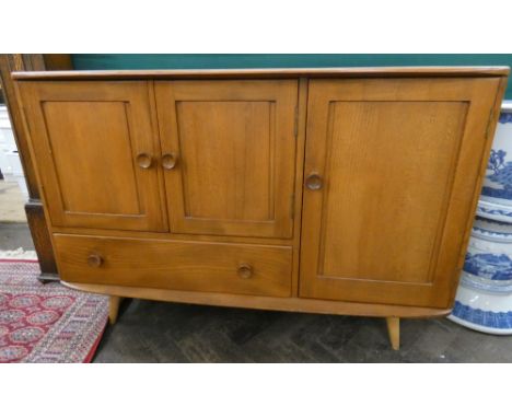 An Ercol golden dawn sideboard fitted with cupboards and one draw, 45" wide     In good condition no obvious signs of damage,