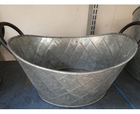 A galvanized oval planter 41cm x 31 cm x 18 deep