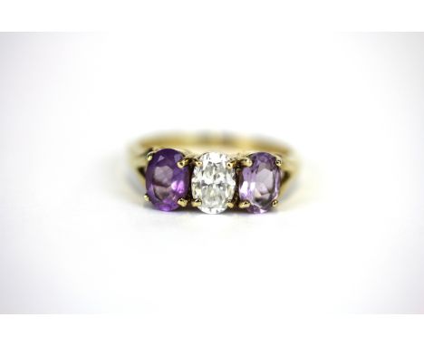 A 9ct yellow gold amethyst and white stone set ring, (P).