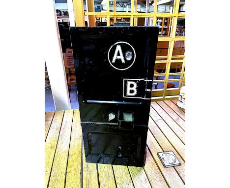 An original "press button A" telephone box coin reciever box and mechanism.