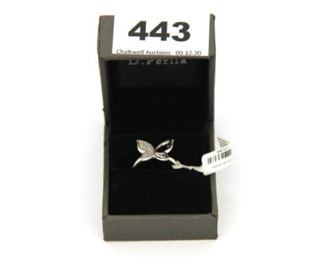 A silver ring set with 0.2ct of diamonds shaped in a butterfly.