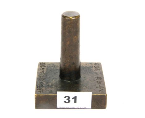 A cast bronze scholar's seal with engraved characters to top and side.