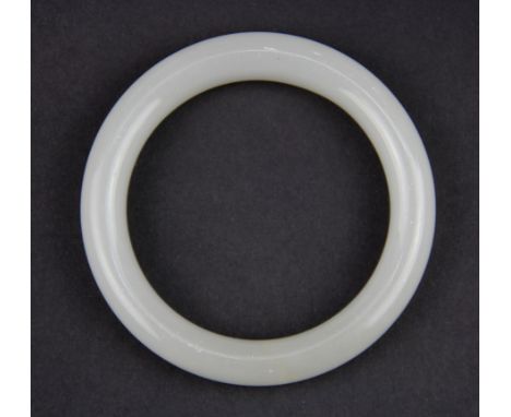 A polished with jade bangle, Internal Dia. 6cm. W. 1.8cm.