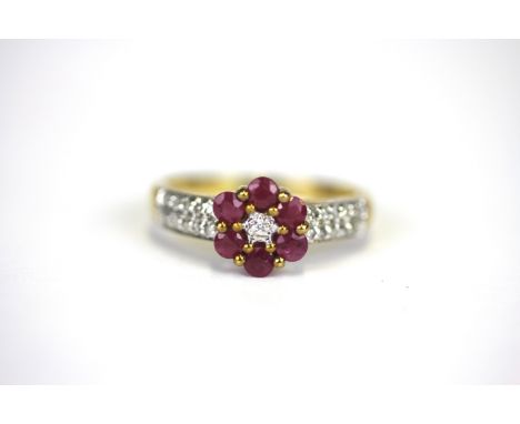 A 9ct yellow gold ruby and diamond set cluster ring, (M).