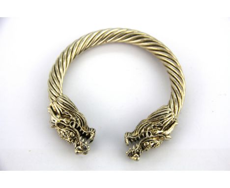 A heavy Chinese white metal dragon bangle.