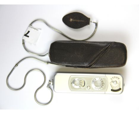 A Minox B Subminiature espionage camera (1958-1969) with a leather case.