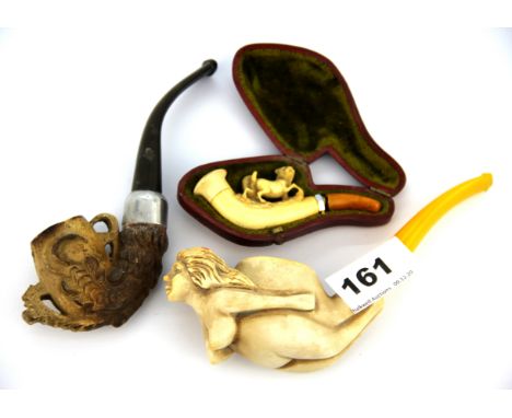 A cased meerschaum cheroot holder (A/F) together with a further meerschaum pipe with a bird claw decoration and a later meers